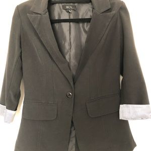 Women’s black blazer with cuffed sleeves